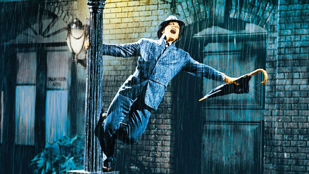 gene-kelly-lamppost-original.jpeg Ator Gene Kelly em cena do musical 'Cantando na Chuva'