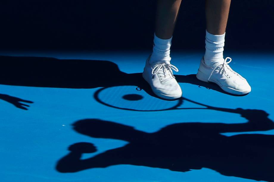 Tennis - Australian Open - Melbourne Park, Melbourne, Australia - 25/1/17 A ballboy passes tennis balls to Bulgaria's Grigor Dimitrov as he prepares to serve during his Men's singles quarter-final match against Belgium's David Goffin. REUTERS/Jason Reed