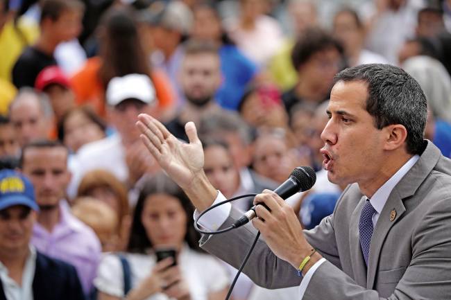 Venezuelan opposition leader Juan Guaido speaks during a gathering with supporters in Caracas