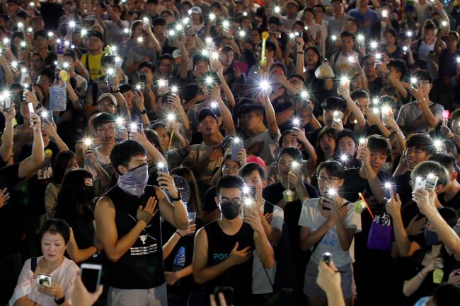 People hold up mobile phones during the Mid-Autumn Festival, in Sha Tin, Hong Kong People hold up mobile phones during the Mid-Autumn Festival, in Sha Tin, Hong Kong