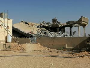 Destroyed headquarters of Kataib Hezbollah militia group are seen after in an air strike in Qaim