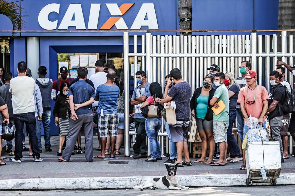 Crowds Line Up at Caixa Economica Federal to Receive Urgent Government Benefit Amidst the Coronavirus (COVID – 19) Pandemic .
