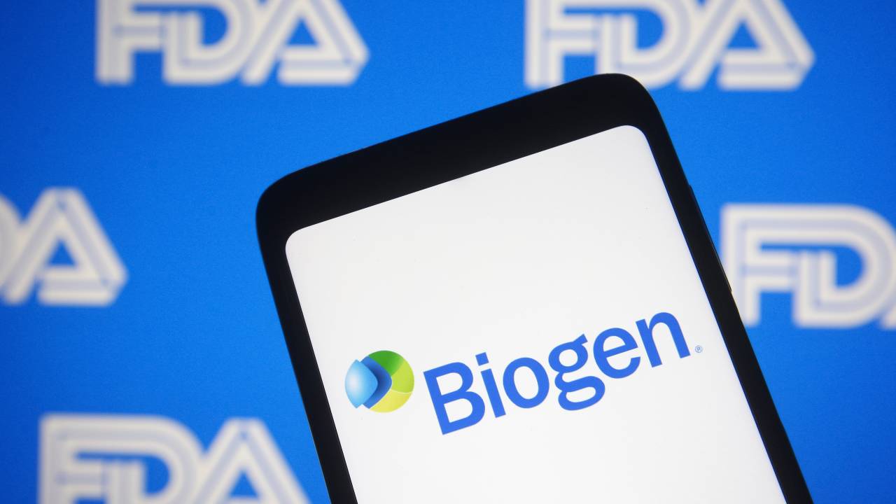 UKRAINE - 2021/06/07: In this photo illustration the Biogen logo of a biotechnology company is seen on a smartphone with a Food and Drug Administration (FDA or USFDA) logo in the background. The U.S. FDA approves Biogen Alzheimer's drug, reportedly by media. (Photo Illustration by Pavlo Gonchar/SOPA Images/LightRocket via Getty Images)
