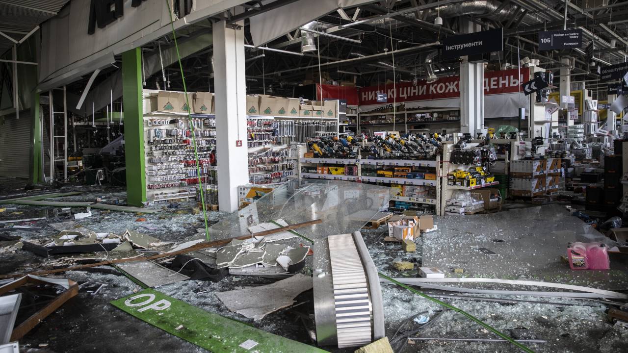 KYIV, UKRAINE - MARCH 21: A view of destroyed buildings and vehicles after Russian attacks on a shopping mall, in Kyiv, Ukraine on March 21, 2022. It is reported that, 8 people were killed in the Russian attack on shopping mall. (Photo by Emin Sansar/Anadolu Agency via Getty Images)