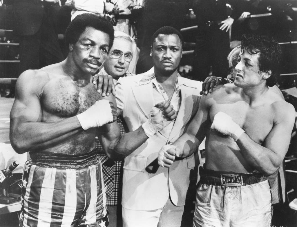 Sylvester Stallone e Carl Weathers, no filme Rocky- Um Lutador, de John G. Avildsen. .