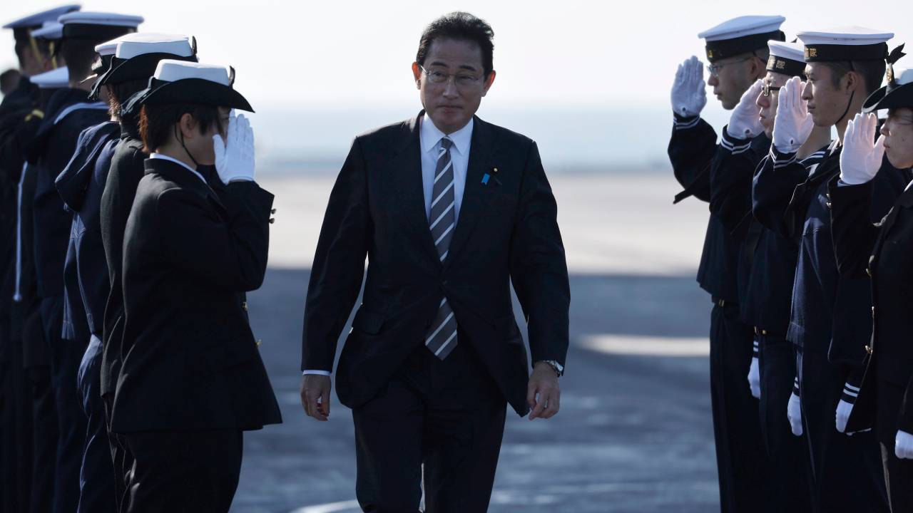YOKOSUKA, JAPAN - NOVEMBER 06: Japanese Prime Minister Fumio Kishida is saluted by members of the Japan Maritime Self-Defence Force during an International Fleet Review commemorating the 70th anniversary of the founding of the Japan Maritime Self-Defence Force at Sagami Bay on November 6, 2022 off Yokosuka, Japan. The Japan Maritime Self-Defence Force (JMSDF) is commemorating the 70th anniversary of their founding today. (Photo by Issei Kato - Pool/Getty Images)
