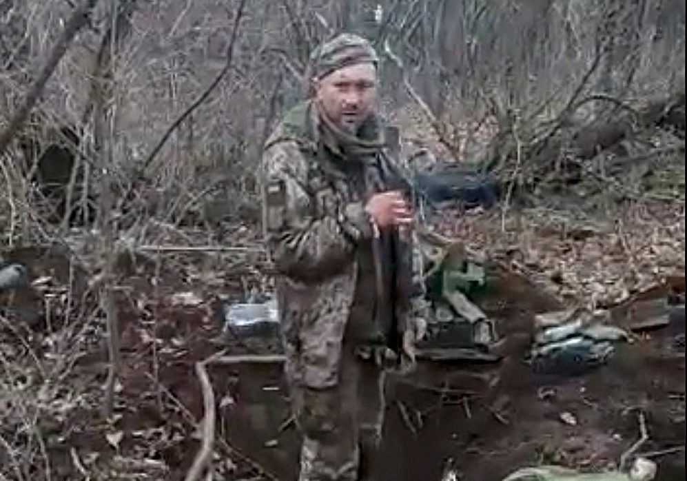 This handout photograph taken from a video grab and released by Ukrainian Presidential press service on March 7, 2023, shows what appears to be a detained Ukrainian combatant of the 30th separate mechanised brigade, Tymofiy Shadura, smoking a cigarette before being shot. - Ukraine's Foreign minister on March 6, 2023 urged the International Criminal Court to probe footage circulating on social media that he said showed Russian forces killing a Ukrainian prisoner of war. "Horrific video of an unarmed Ukrainian POW executed by Russian forces merely for saying 'Glory to Ukraine'. Another (piece of) proof this war is genocidal," Foreign Minister Dmytro Kuleba wrote on social media. (Photo by Handout / UKRAINIAN PRESIDENTIAL PRESS SERVICE / AFP) / -----EDITORS NOTE --- RESTRICTED TO EDITORIAL USE - MANDATORY CREDIT "AFP PHOTO/ HANDOUT/ UKRAINIAN PRESIDENTIAL PRESS SERVICE - NO MARKETING - NO ADVERTISING CAMPAIGNS - DISTRIBUTED AS A SERVICE TO CLIENTS