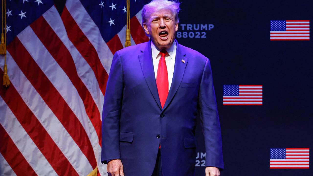 (FILES) In this file photo taken on March 13, 2023, former US President Donald Trump arrives for an event at the Adler Theatre in Davenport, Iowa. - Senior Republicans on March 19, 2023, echoed Donald Trump's claim that a looming indictment in a hush-money case would amount to political "persecution," while Democrats warned his call for protests could trigger a repeat of chaos his supporters unleashed at the US Capitol. (Photo by KAMIL KRZACZYNSKI / AFP)