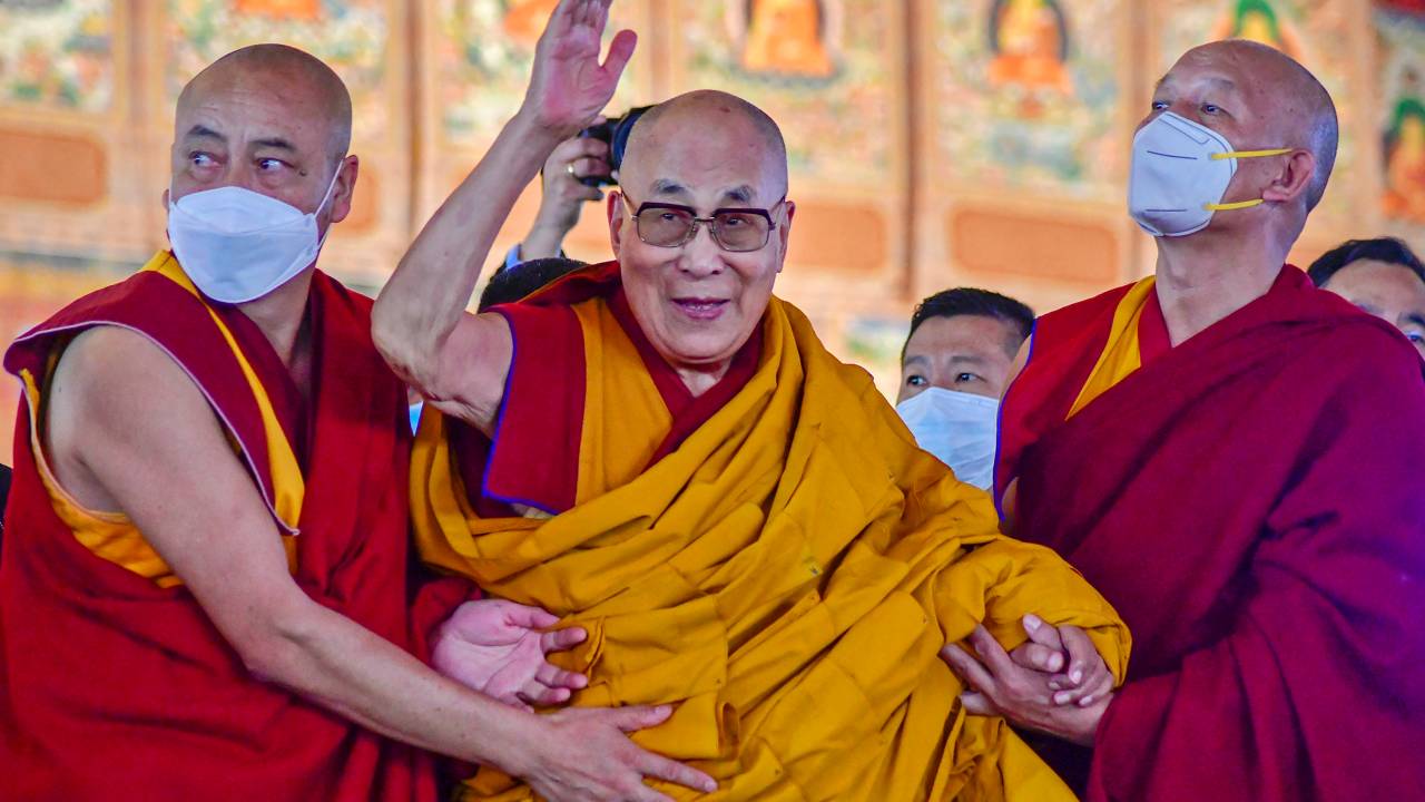 (FILES) In this file photo taken on December 29, 2022, Tibetan spiritual leader Dalai Lama waves during his first day of teaching session at the Kalachakra Ground in Bodhgaya. - The Tibetan spiritual leader the Dalai Lama apologised on April 10, 2023 after a video which showed him asking a boy to suck his tongue triggered a backlash on social media. (Photo by Sanjay KUMAR / AFP)