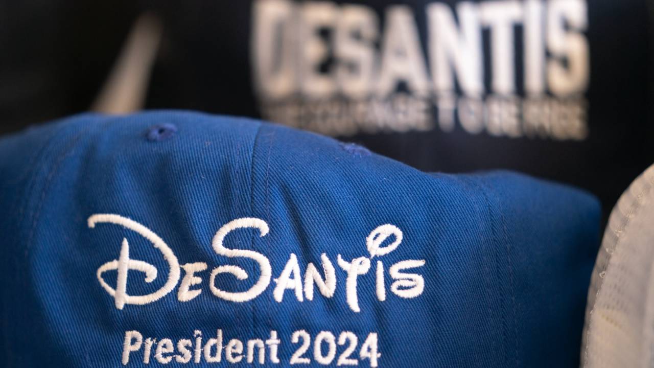 Baseball caps promoting Florida Governor Ron DeSantis sit on a table before a book tour event at the North Charleston Coliseum on April 19, 2023 in North Charleston, South Carolina. The Governor's appearance marks his first official visit to the "First in the South" presidential primary state amid mounting anticipation of his 2024 presidential candidacy.