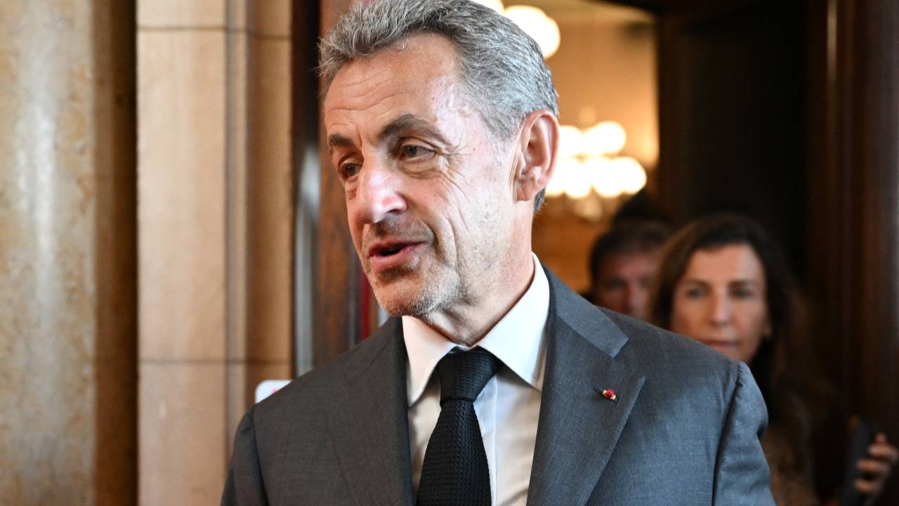 Former French President Nicolas Sarkozy leaves the courthouse after the ruling in his appeal trial in a corruption case at Paris courthouse on May 17, 2023. A French court of appeals on May 17, 2023 upheld a prison sentence of three years, including two suspended, against former president Nicolas Sarkozy for corruption and influence peddling. (Photo by bERTRAND GUAY / AFP)