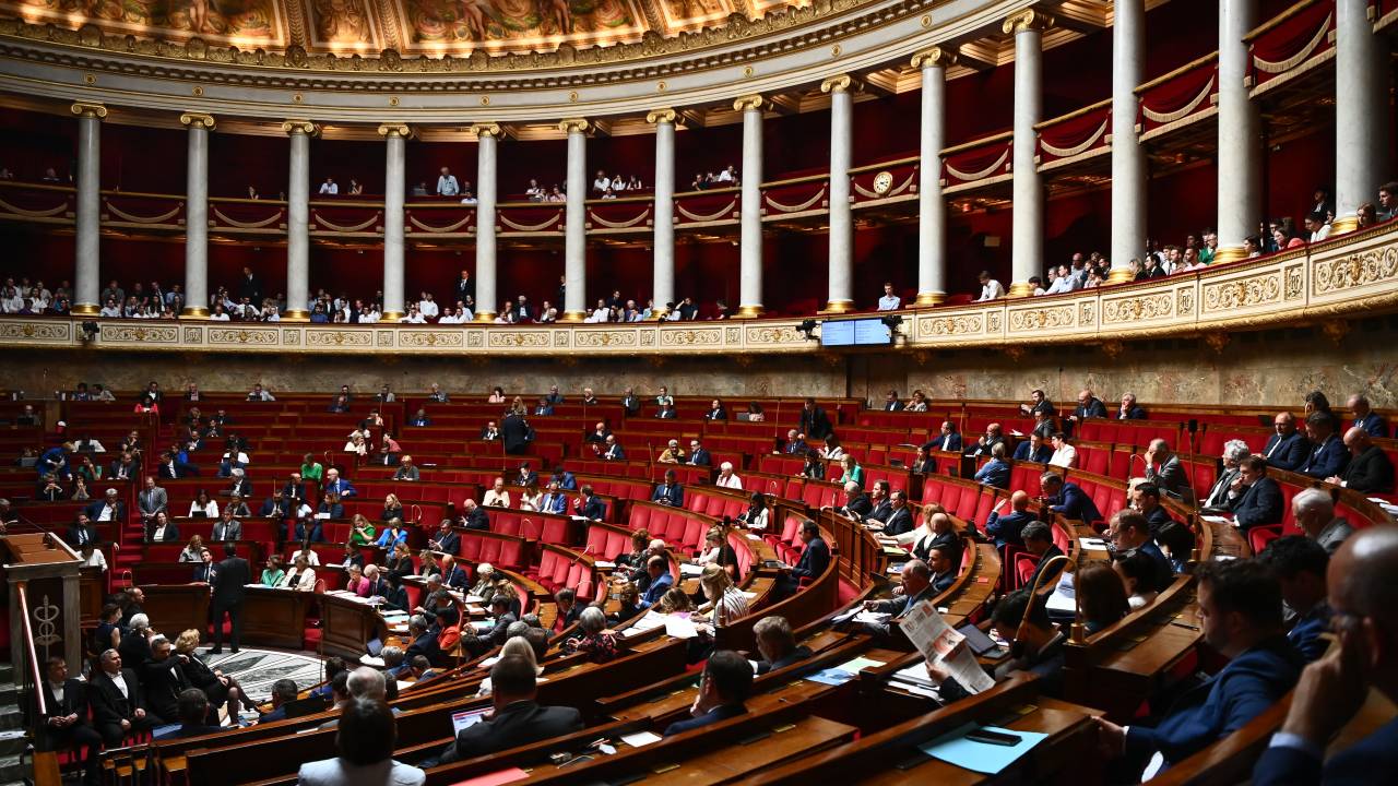 Members of Parliament attend a parliamentary session at the French National Assembly in Paris on June 13, 2023. (Photo by Christophe ARCHAMBAULT / AFP)