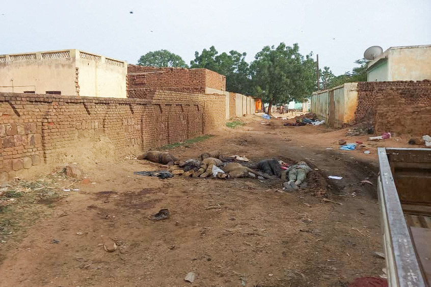 EDITORS NOTE: Graphic content / A picture taken on June 16, 2023, shows bodies strewn outdoors near houses in the West Darfur state capital El Geneina, amid ongoing fighting between two generals in war-torn Sudan. The UN, African Union and east African regional bloc IGAD, in a joint statement on June 19 expressed particular concern about "the rapidly deteriorating situation in Darfur", adding the conflict had "taken on an ethnic dimension, resulting in targeted attacks based on people's identities and subsequent displacement of communities". (Photo by AFP)