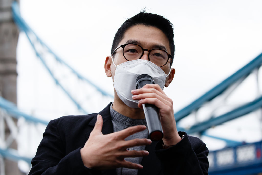 Exiled Hong Kong pro-democracy activist Nathan Law addresses a 'Save 12 HK Youths' rally at Potters Fields Park beside Tower Bridge in London, England, on October 24, 2020. The 'Save 12 HK Youths' campaign calls for the release of 12 young pro-democracy activists held since August in mainland China having been caught trying to flee Hong Kong by boat, reportedly for Taiwan. Today's London rally marks Law's first public appearance since he fled to the UK in July, following the introduction of the security law imposed in Hong Kong by China that activists say erodes the city's freedoms. (Photo by David Cliff/NurPhoto via Getty Images)