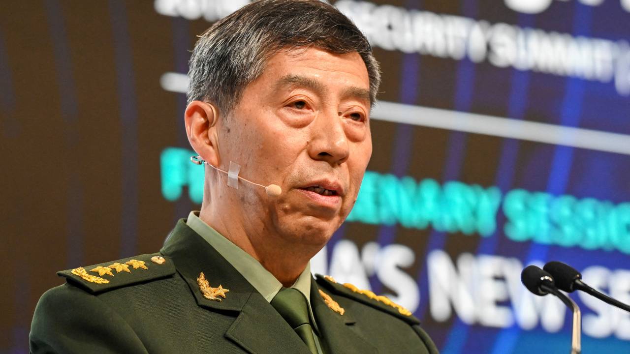 (FILES) China's Minister of National Defence Li Shangfu delivers a speech during the 20th Shangri-La Dialogue summit in Singapore on June 4, 2023. The US government believes China's Defense Minister Li Shangfu is the subject of an investigation by Beijing and has been relieved of his duties, the Financial Times reported, citing American officials. (Photo by ROSLAN RAHMAN / AFP)