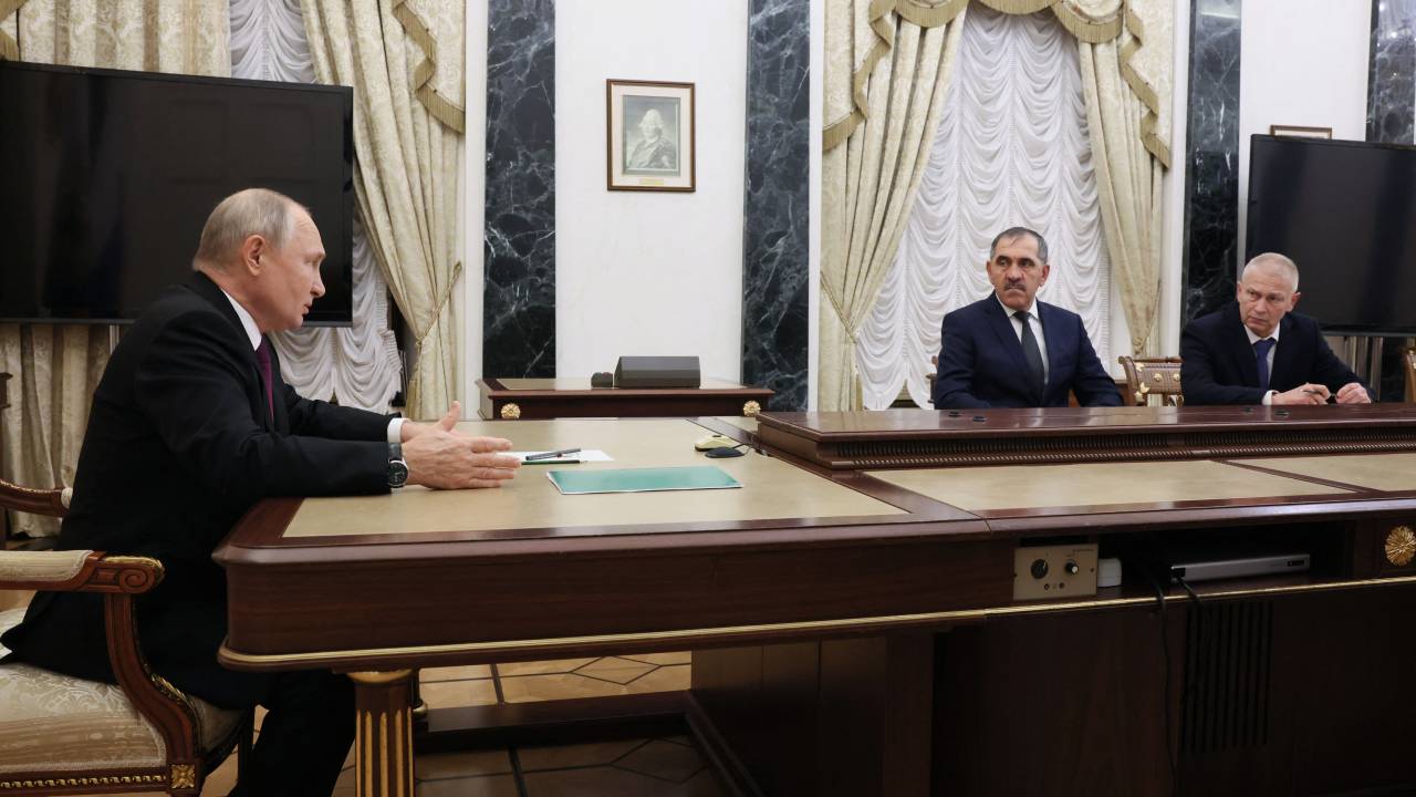 In this pool photograph distributed by Sputnik agency Russia's President Vladimir Putin (L) attends a meeting with Russian Deputy Defence Minister Yunus-Bek Yevkurov (2R) and chairman of the League for Protecting Interests of Veterans of Local Wars and Military Conflicts, Andrei Troshev (R) at the Kremlin in Moscow on September 28, 2023. (Photo by Mikhail Metzel / POOL / AFP)