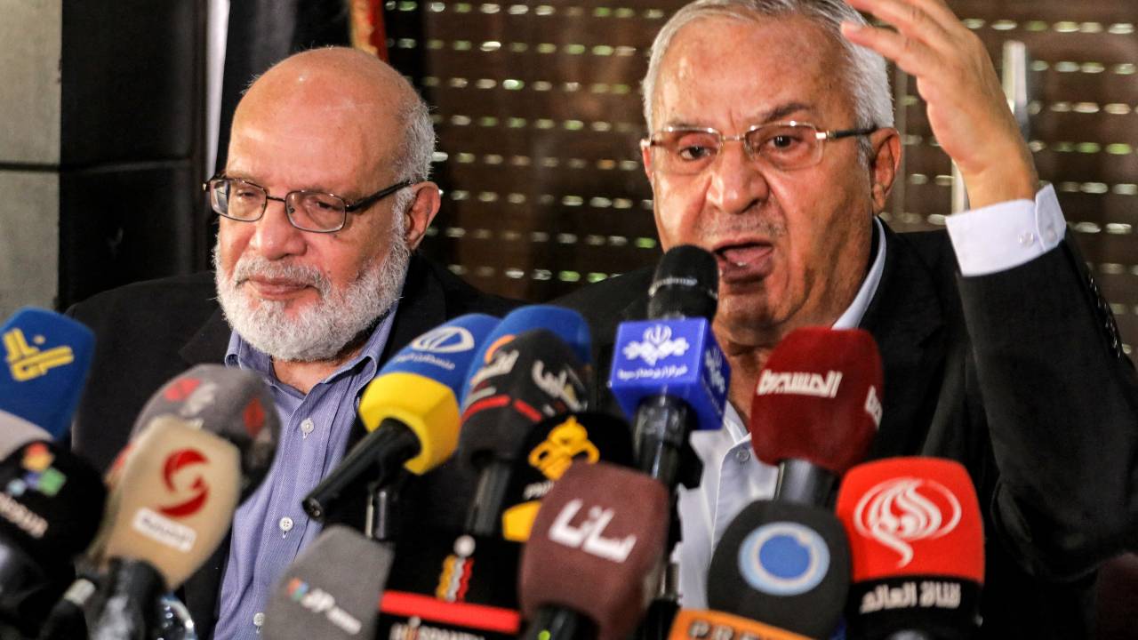 Talal Naji (R), secretary-general of the Popular Front for the Liberation of Palestine-General Command (PFLP-GC) speaks while seated next to Abdulaziz al-Minawi, senior official of the Palestinian Islamic Jihad movement, during a meeting of the Palestinian faction leaders in Damascus on October 11, 2023. Israel declared war on Hamas on October 8 following a shock land, air and sea assault by the Gaza-based Islamists. The death toll from the shock cross-border assault by Hamas militants rose to 1,200, making it the deadliest attack in the country's 75-year history, while Gaza officials reported more than 900 people killed as Israel pounded the territory with air strikes. (Photo by LOUAI BESHARA / AFP)