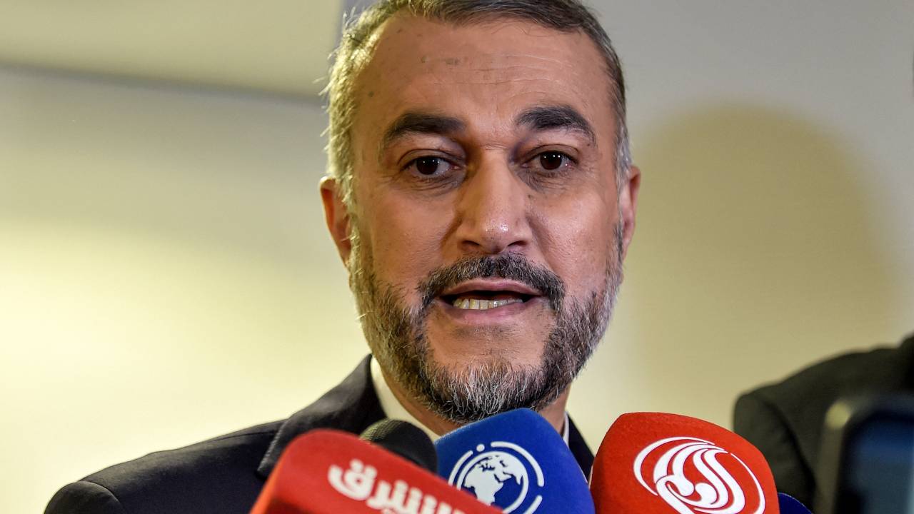 Iran's Foreign Minister Hossein Amir Abdollahian speaks to journalists as he arrives in Jeddah to attend an extraordinary meeting of the Organisation of Islamic Cooperation's (OIC) executive committee on October 18, 2023 regarding the situation in the besieged Gaza Strip. (Photo by Amer HILABI / AFP)