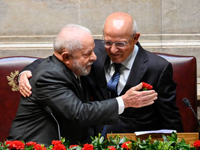 Portugal Hosts State Visit Of The President Of Brazil Luiz Inácio Lula Da Silva LISBON, PORTUGAL - APRIL 25: The President of Portuguese Parliament Augusto Santos Silva (R) is embraced by the President of the Federative Republic of Brazil Luiz Inácio Lula da Silva at the then of his opening remarks during the Formal Session to welcome the Brazilian President at the Portuguese Parliament on Lula's State Visit last day to the country on April 25, 2023, in Lisbon, Portugal. During his five-day State Visit President Lula met with the President of Portugal Marcelo Rebelo de Sousa, and with Portuguese Prime Minister Antonio Costa. Participated in a Luso-Brazilian Summit, and also attended the Bilateral Economic Forum in Matosinhos, near Porto and the awarding ceremony of the Camões Prize to Brazilian singer and composer Chico Buarque. (Photo by Horacio Villalobos#Corbis/Corbis via Getty Images)