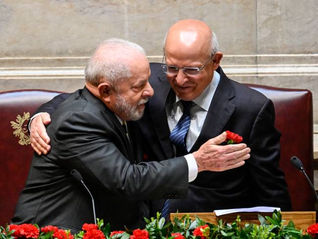 LISBON, PORTUGAL - APRIL 25: The President of Portuguese Parliament Augusto Santos Silva (R) is embraced by the President of the Federative Republic of Brazil Luiz Inácio Lula da Silva at the then of his opening remarks during the Formal Session to welcome the Brazilian President at the Portuguese Parliament on Lula's State Visit last day to the country on April 25, 2023, in Lisbon, Portugal. During his five-day State Visit President Lula met with the President of Portugal Marcelo Rebelo de Sousa, and with Portuguese Prime Minister Antonio Costa. Participated in a Luso-Brazilian Summit, and also attended the Bilateral Economic Forum in Matosinhos, near Porto and the awarding ceremony of the Camões Prize to Brazilian singer and composer Chico Buarque. (Photo by Horacio Villalobos#Corbis/Corbis via Getty Images)