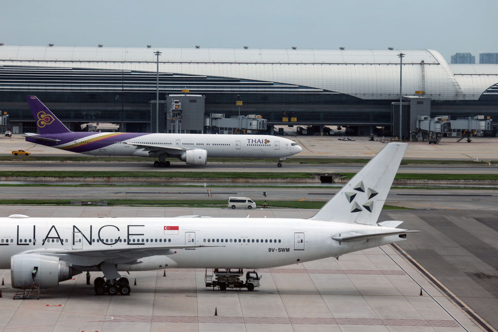 A Boeing Co. 777-300ER aircraft operated by Singapore Airlines Ltd. on the tarmac at Suvarnabhumi Airport in Bangkok, Thailand, on Wednesday, May 22, 2024. A British man was killed and seven other people were critically injured after the Singapore Airlines jet flying from London to its home country encountered severe turbulence as it entered Thai airspace. Photographer: Valeria Mongelli/Bloomberg via Getty Images