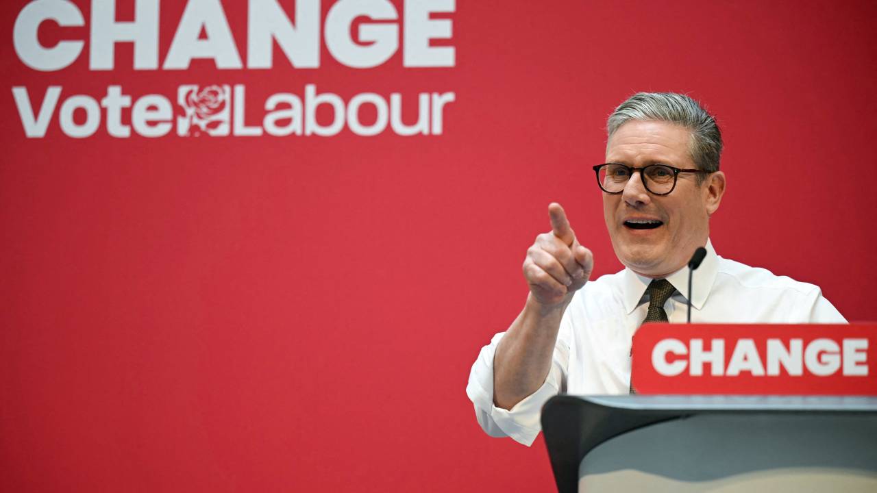 (FILES) Britain's main opposition Labour Party leader Keir Starmer delivers a speech on stage during the launching of Labour Party election manifesto, in Manchester, on June 13, 2024 in the build-up to the UK general election on July 4. UK Labour leader Keir Starmer, 61, is a former human rights lawyer turned-state prosecutor whose ruthless ambition and formidable work ethic look set to propel him to Britain's highest political office. (Photo by Oli SCARFF / AFP)