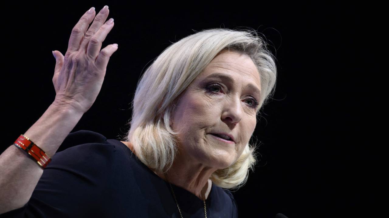 (FILES) President of the French far-right Rassemblement National (RN) parliamentary group Marine Le Pen delivers a speech during a campaign meeting for the forthcoming European union (EU) parliamentary elections scheduled for June 2024, in Perpignan, southern France, on May 1, 2024. President of the French far-right Rassemblement National (RN) parliamentary group Marine Le Pen takes the opportunity to condemn the "stigmatisation of Jews" by the "extreme left" after France's left-wing La France Insoumise (LFI) party leader Jean-Luc Melenchon (not in the picture), "horrified" by the facts, denounced "anti-Semitic racism", on June 19, 2024. (Photo by Ed JONES / AFP)