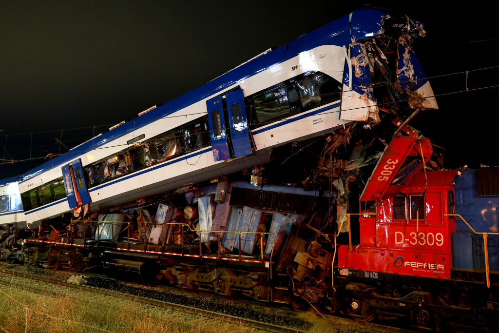 SAN BERNARDO, CHILE - JUNE 20: A view of the scene after a passenger train that collided head-on with a freight train, in San Bernardo, Chile, on Thursday, June 20, 2024. Emergency services are working to remove the bodies of the deceased and the destroyed cars from the tracks. Two dead, one missing and a dozen injured in the accident. (Photo by Lucas Aguayo Araos/Anadolu via Getty Images)