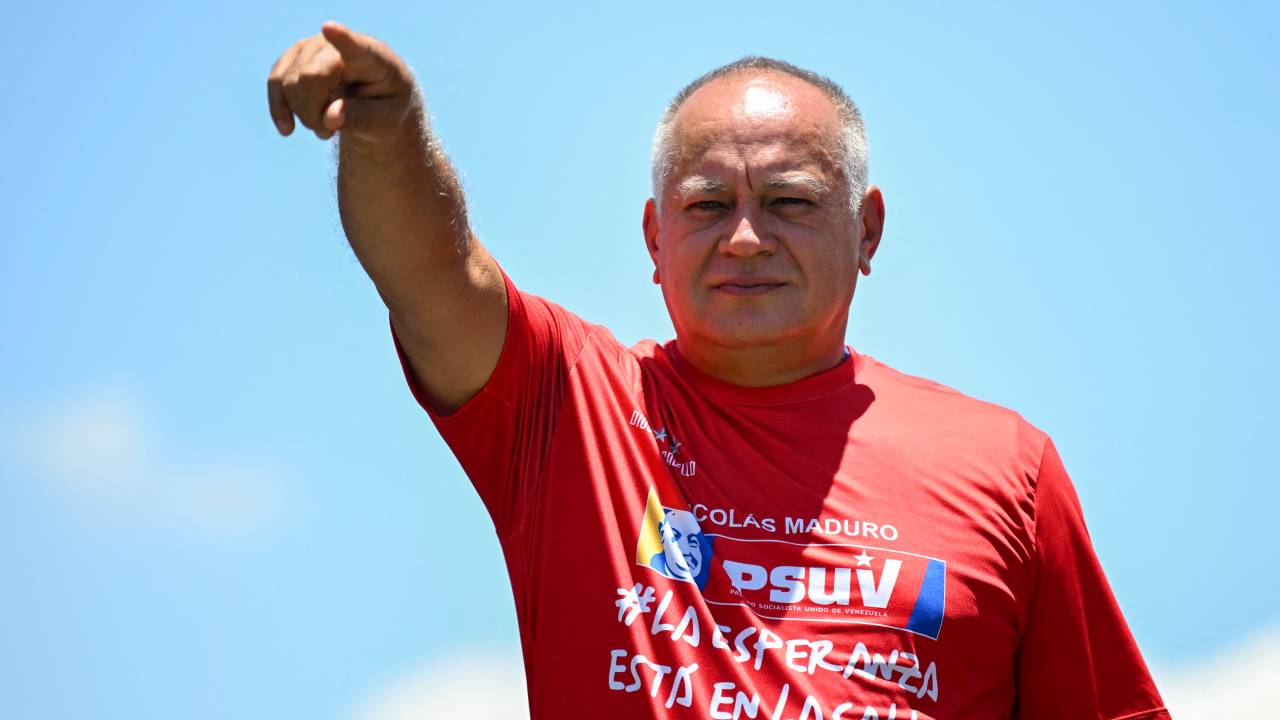 Deputy Diosdado Cabello greets supporters of Venezuelan President and presidential candidate Nicolas Maduro during Maduro's campaign closing rally in Maracaibo, Zulia State, Venezuela, on July 25, 2024, ahead of Sunday's presidential election. Venezuelan President Nicolas Maduro and his main rival in the July 28 presidential elections, opposition candidate Edmundo Gonzalez Urrutia, close their campaigns on Thursday amidst Maduro's warnings of a "bloodbath" or a military insurrection if he is defeated. (Photo by RAUL ARBOLEDA / AFP)
