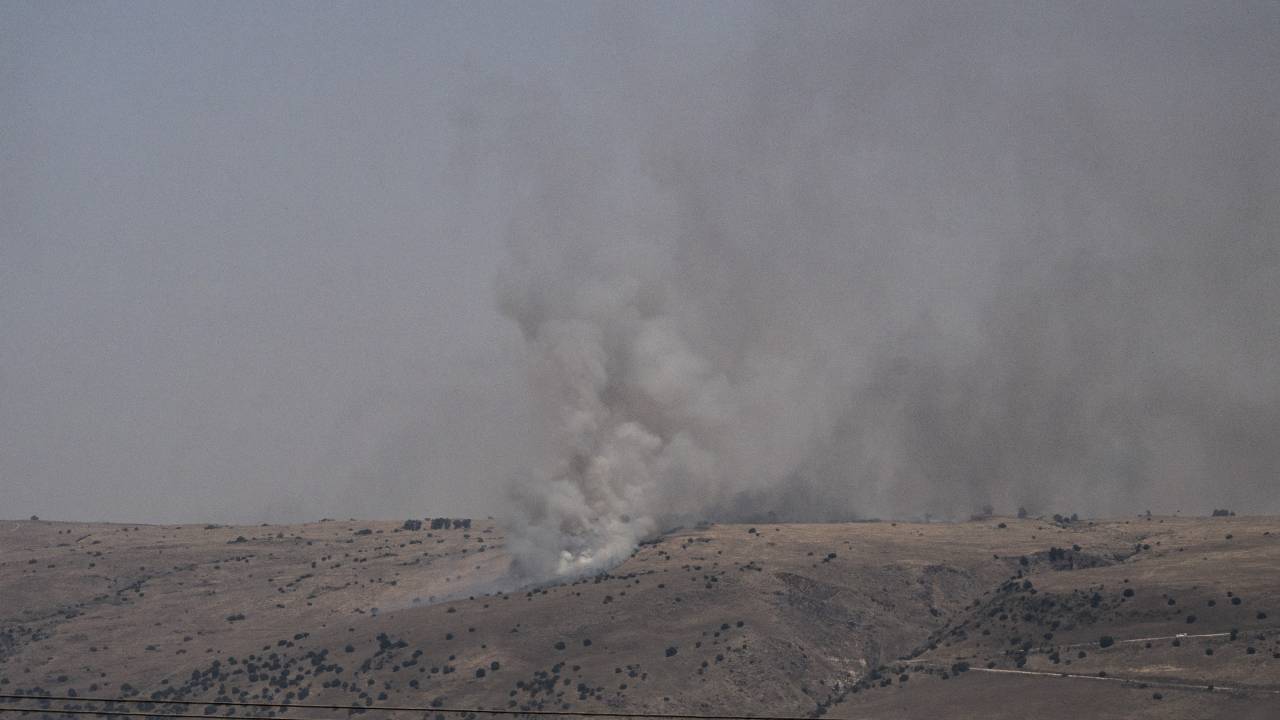 GOLAN HEIGHTS, ISRAEL - JUNE 13: Smoke rises after fire broke out in 15 places in northern Israel due to missiles fired from Lebanon and shrapnel falling during blocking operations at Golan Heights in Israel on June 13, 2024. Firefighting planes took part in the extinguishing works. (Photo by Mostafa Alkharouf/Anadolu via Getty Images)
