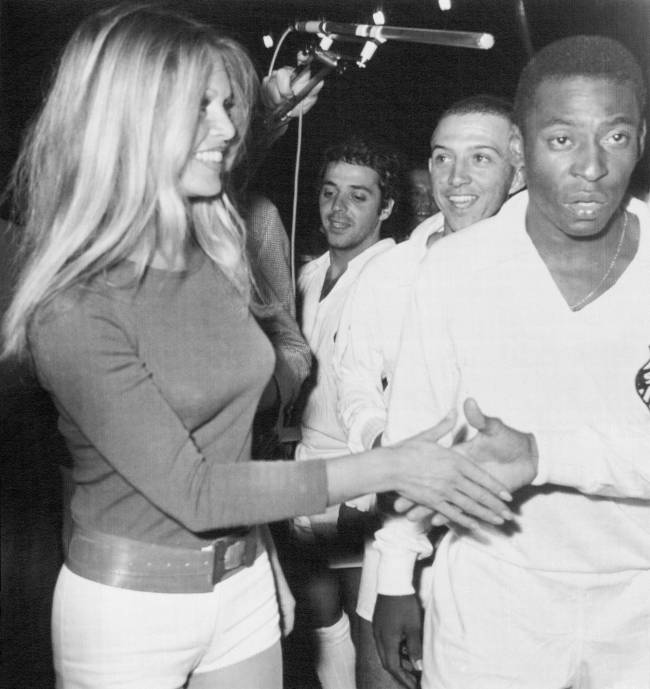 Brigitte Bardot and Pele Soccer king Pele (right), of Brazil, and other team members meet French film star Brigitte Bardot at Colombes Stadium here March 31st during a charity match between the Santos of Brazil and combined French teams of St. Etienne and Marseille.