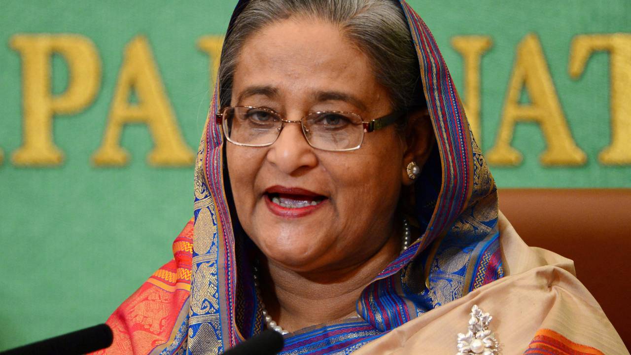 (FILES) Bangladesh Prime Minister Sheikh Hasina speaks at Japan's national press club in Tokyo on May 28, 2014. Cheering protesters stormed Bangladeshi Prime Minister Sheikh Hasina's palace on August 5, 2024, after she fled, the culmination of more than a month of deadly anti-government protests. (Photo by YOSHIKAZU TSUNO / AFP)