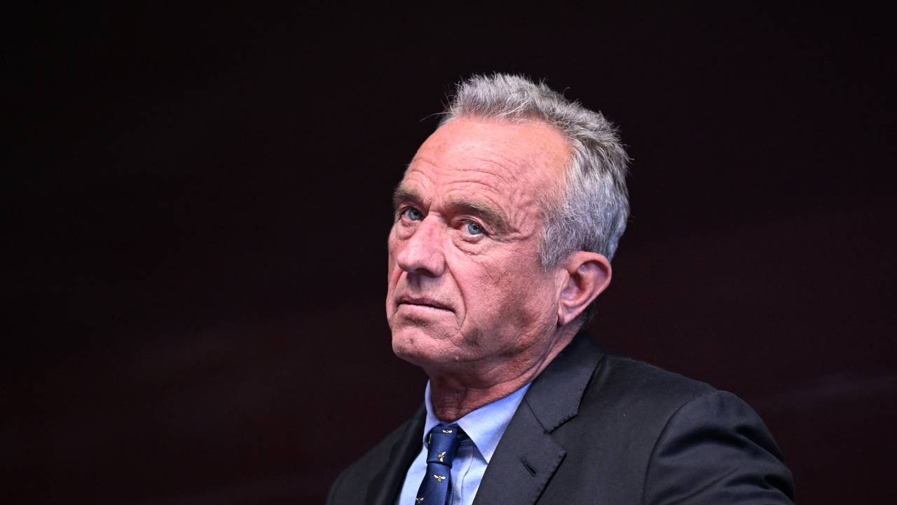 (FILES) Independent presidential candidate Robert F. Kennedy Jr. watches his running mate Nicole Shanahan speak during a campaign event at the Henry J. Kaiser Event Center in Oakland, California, on March 26, 2024. A judge has ruled that presidential candidate Robert F. Kennedy Jr. falsely claimed his residency was in New York and barred him from ballots in the US state, a court document filed on August 13, 2024 revealed. (Photo by JOSH EDELSON / AFP)