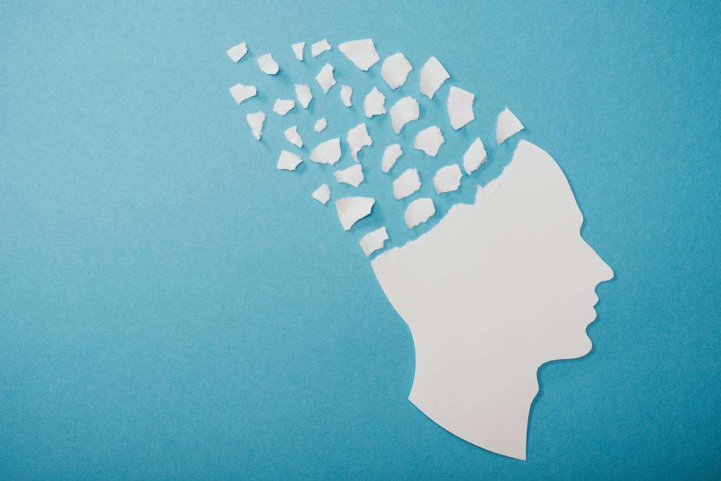 dementia symbol presented as face isolated on blue