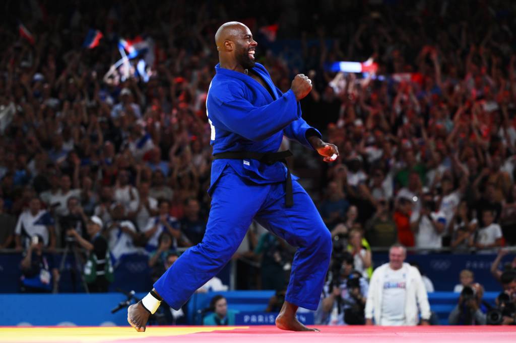 Judo – Olympic Games Paris 2024: Day 7 PARIS, FRANCE - AUGUST 02: Teddy Riner of Team France celebrates winning the gold medal after his victory against Minjong Kim of Team Republic of Korea in the Judo Men +100kg Final on day seven of the Olympic Games Paris 2024 at Champs-de-Mars Arena on August 02, 2024 in Paris, France. (Photo by David Ramos/Getty Images)
