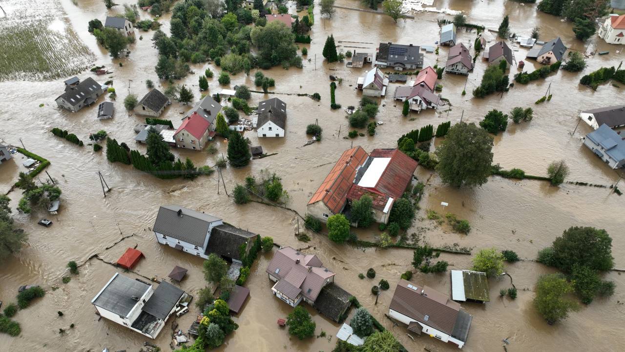This aerial photograph taken on September 15, 2024 shows the flooded village of Rudawa, southern Poland. One person has drowned in Poland and an Austrian fireman has died responding to floods, authorities said, as Storm Boris lashed central and eastern Europe with torrential rains. Since Thursday, September 12, 2024, swathes of Austria, the Czech Republic, Hungary, Romania and Slovakia have been hit by high winds and unusually fierce rainfall. The storm had already caused the death of five people in Romania, and thousands have been evacuated from their homes across the continent. (Photo by Sergei GAPON / AFP)