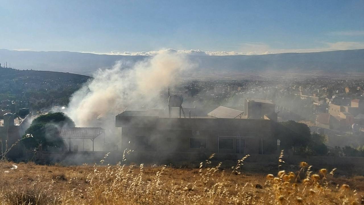 Smoke billows from a house in Baalbek in east Lebanon after a reported explosion of a radio device, on September 18, 2024, amid ongoing cross-border tensions between Israel and Hezbollah fighters. Communication devices exploded on July 18 in Hezbollah strongholds in Lebanon, as the Iran-backed group vowed to retaliate against Israel after a deadly wave of pager blasts that has raised fears of an all-out war. (Photo by AFP)