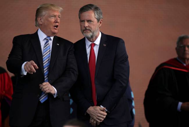 LYNCHBURG, VA - MAY 13: U.S. President Donald Trump (L) and Jerry Falwell (R), President of Liberty University, on stage during a commencement at Liberty University May 13, 2017 in Lynchburg, Virginia. President Trump is the first sitting president to speak at Liberty's commencement since George H.W. Bush spoke in 1990. (Photo by Alex Wong/Getty Images)