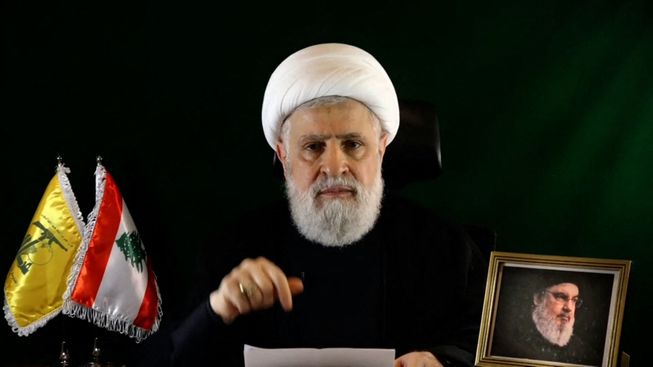 (FILES) An image grab taken from Hezbollah's Al-Manar TV shows the group's deputy chief Naim Qassem delivering a speech from an undisclosed location on October 15, 2024. Hezbollah on October 29 said Qassem was elected to succeed its leader Hasan Nasrallah, who was killed late last month by an Israeli strike on Beirut's southern suburbs. (Photo by Al-Manar / AFP) / RESTRICTED TO EDITORIAL USE - MANDATORY CREDIT "AFP PHOTO / HO / AL-MANAR" - NO MARKETING NO ADVERTISING CAMPAIGNS - DISTRIBUTED AS A SERVICE TO CLIENTS