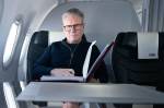 Britain's Prime Minister Keir Starmer poses for a photograph as he works whilst travelling on a Government aeroplane on November 17, 2024, en route to attend the G20 summit in Rio de Janeiro, Brazil. The G20 Leaders' Summit will take place in Rio de Janeiro between November 18 and 19, 2024. (Photo by Stefan Rousseau / POOL / AFP)