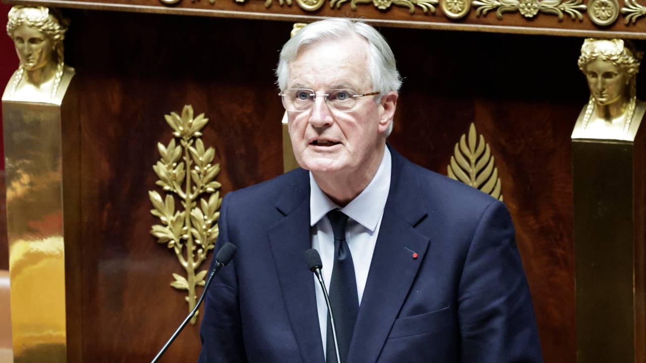 French Prime Minister Michel Barnier delivers a speech during the voting session on the draft of the Social Security bill 2025 at the National Assembly, the French Parliament's lower house, in Paris on December 2, 2024. French Prime Minister faces the biggest risk yet of being deposed by a hostile National Assembly as his government on December 2, 2024, presents a social security financing plan that has the opposition up in arms. These include planned cuts in employer social contributions, a partial end to inflation-indexing of pensions and a less generous prescription drug reimbursement policy. (Photo by STEPHANE DE SAKUTIN / AFP)