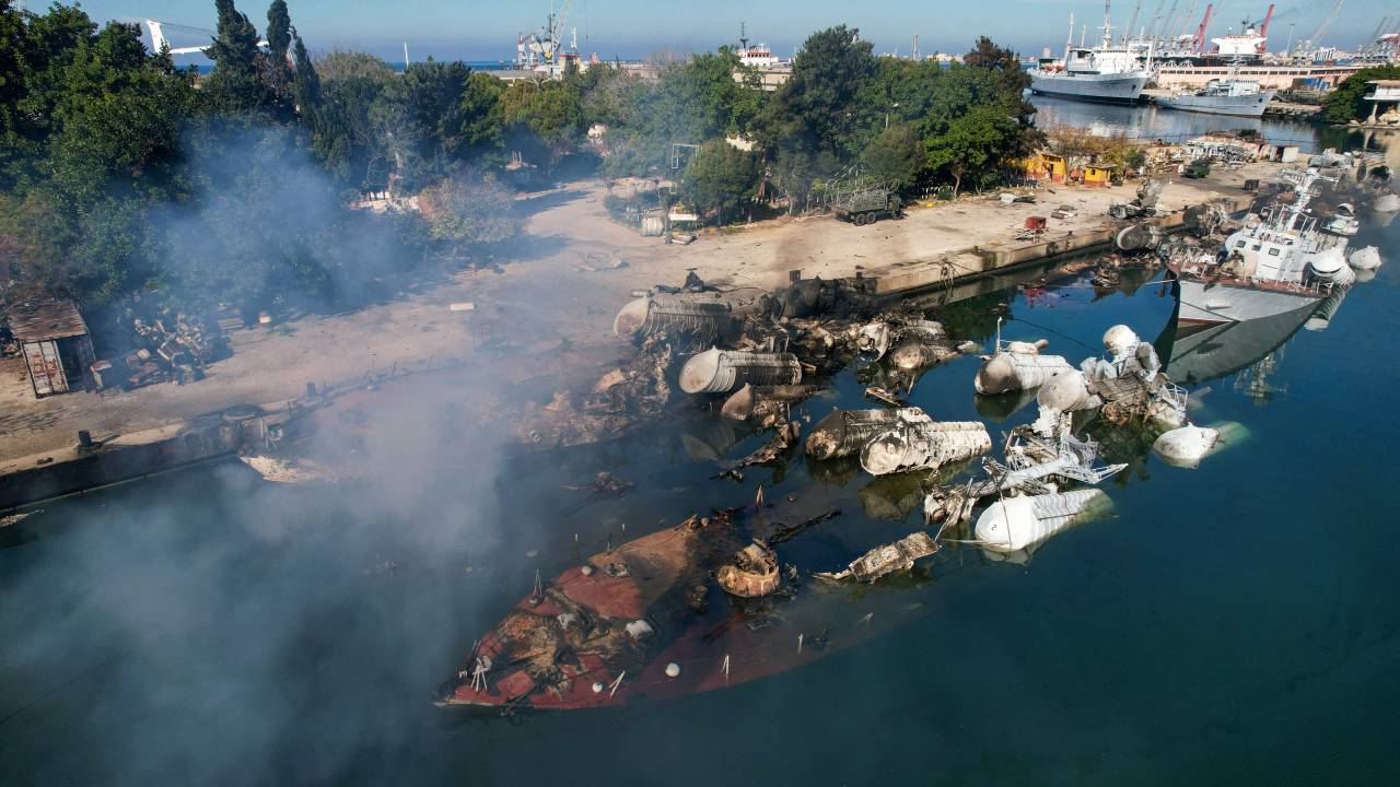 An aerial photo shows Syrian naval ships destroyed in an overnight Israeli attack on the port city of Latakia on December 10, 2024. The UN special envoy for Syria on December 10 called on Israel to halt its military movements and bombardments inside Syria, days after the fall of president Bashar al-Assad. (Photo by AAREF WATAD / AFP)