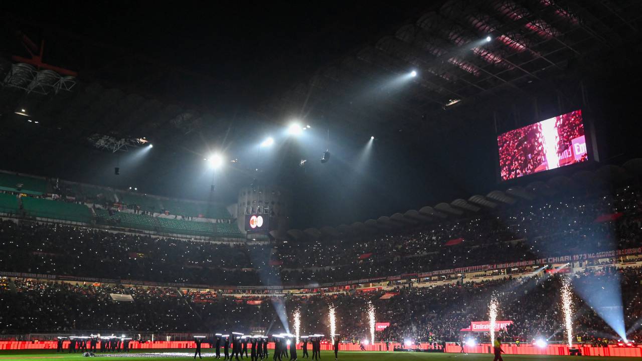 This photograph shows a view of a light show and a choreography for the 125th Anniversary of the club prior to prior to the Italian Serie A football match between AC Milan and Genoa at the San Siro Stadium in Milan, on December 15, 2024. (Photo by Piero CRUCIATTI / AFP)