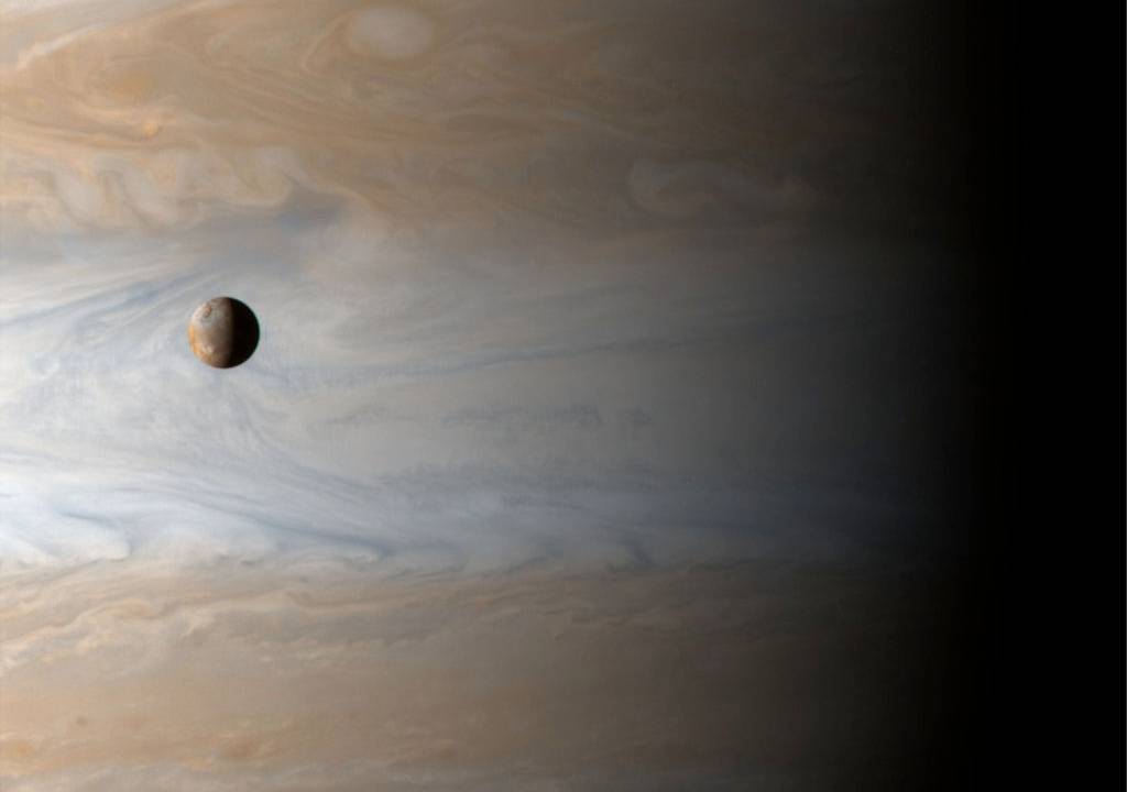 388097 01: Gliding past the planet Jupiter, the Cassini spacecraft captures this awe inspiring view of active Io, Jupiter's third largest satellite, with the largest gas giant as a backdrop, offering a stunning demonstration of the ruling planet's relative size, April 20, 2001. The Cassini spacecraft itself was about 10 million kilometers from Jupiter when recording the image data. (Photo courtesy of NASA/Newsmakers)