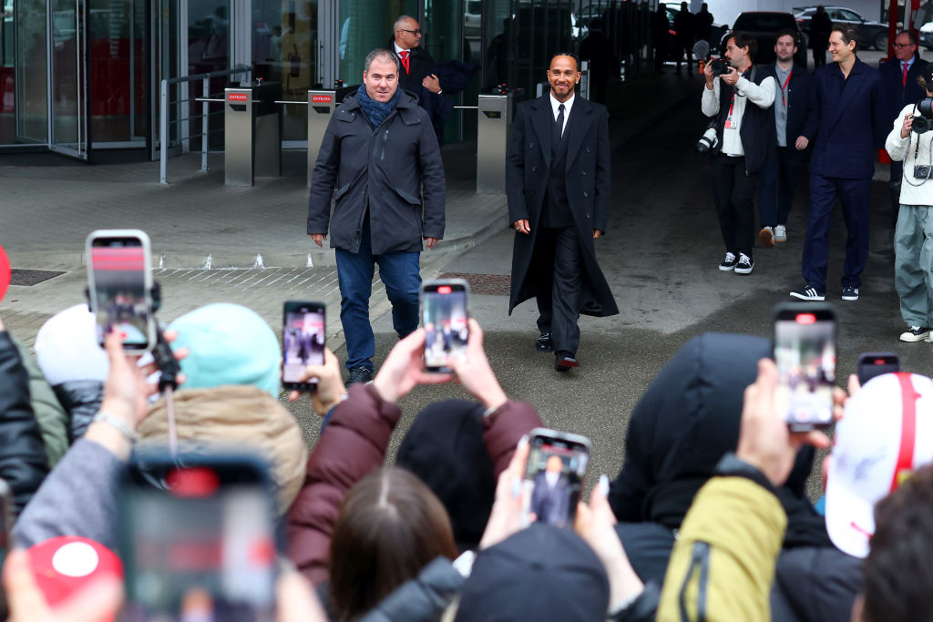 FIORANO MODENESE, ITALY - JANUARY 20: Sir Lewis Hamilton greets fans during his first official days as a Scuderia Ferrari F1 driver at Fiorano Circuit on January 20, 2025 in Fiorano Modenese, Italy. (Photo by Clive Rose/Getty Images)