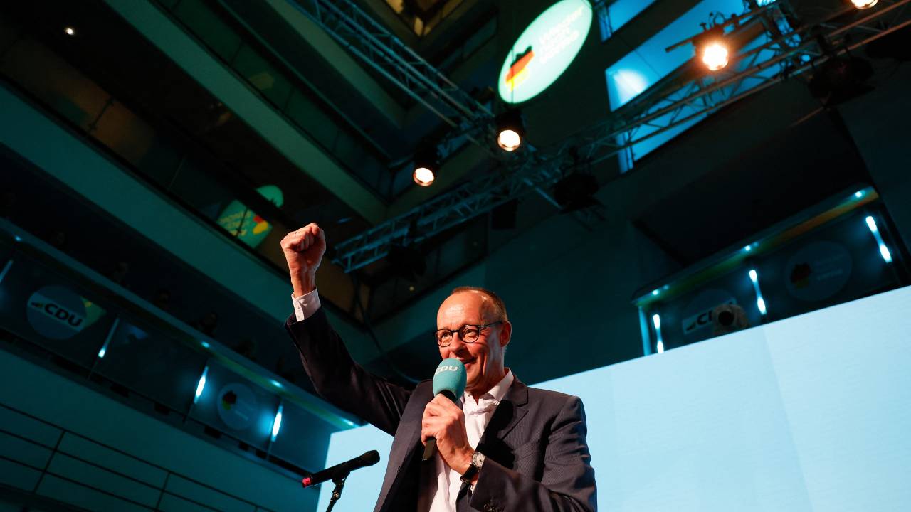 Friedrich Merz, leader of Germany's conservative Christian Democratic Union (CDU) and his party's main candidate for Chancellor addresses supporters at the electoral evening in Berlin on February 23, 2025. (Photo by Odd ANDERSEN / AFP)