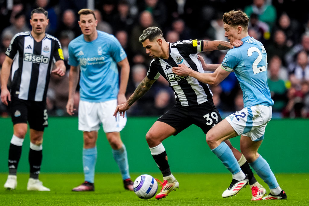 NEWCASTLE UPON TYNE, ENGLAND - FEBRUARY 23: Bruno Guimaraes of Newcastle United FC is challenged by Ryan Yates of Nottingham Forest FC during the Premier League match between Newcastle United FC and Nottingham Forest FC at St James' Park on February 23, 2025 in Newcastle upon Tyne, England. (Photo by Rene Nijhuis/MB Media/Getty Images)
