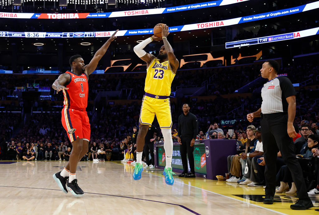 LOS ANGELES, CALIFORNIA - MARCH 04: LeBron James #23 of the Los Angeles Lakers shoots a 3-point basket to score his 50,002 NBA regular season and playoff career points during the first half against Zion Williamson #1 of the New Orleans Pelicans at Crypto.com Arena on March 04, 2025 in Los Angeles, California. NOTE TO USER: User expressly acknowledges and agrees that, by downloading and or using this photograph, User is consenting to the terms and conditions of the Getty Images License Agreement. (Photo by Ronald Martinez/Getty Images)