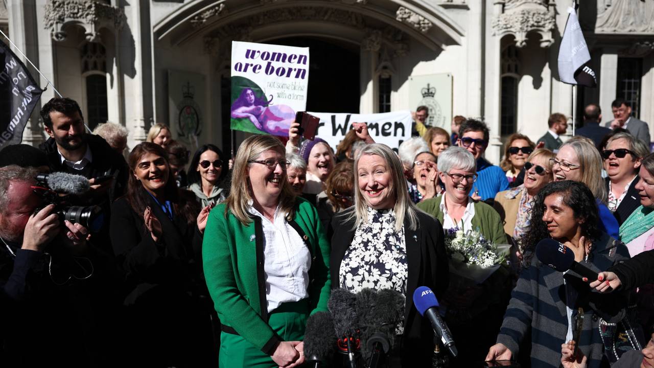 Susan Smith (L) and Marion Calder, Directors of For Women Scotland make a statement outside Britain's Supreme Court in London on April 16, 2025, following the court's ruling on how to define a 'woman'. Britain's Supreme Court said the legal definition of a "woman" is based on a person's sex at birth, a landmark ruling with far-reaching implications to the bitter debate over trans rights. In a win for Scottish gender-critical campaigners who brought the case to the UK's highest court, five London judges unanimously ruled "the terms 'woman' and 'sex' in the Equality Act 2010 refer to a biological woman, and biological sex". (Photo by HENRY NICHOLLS / AFP)