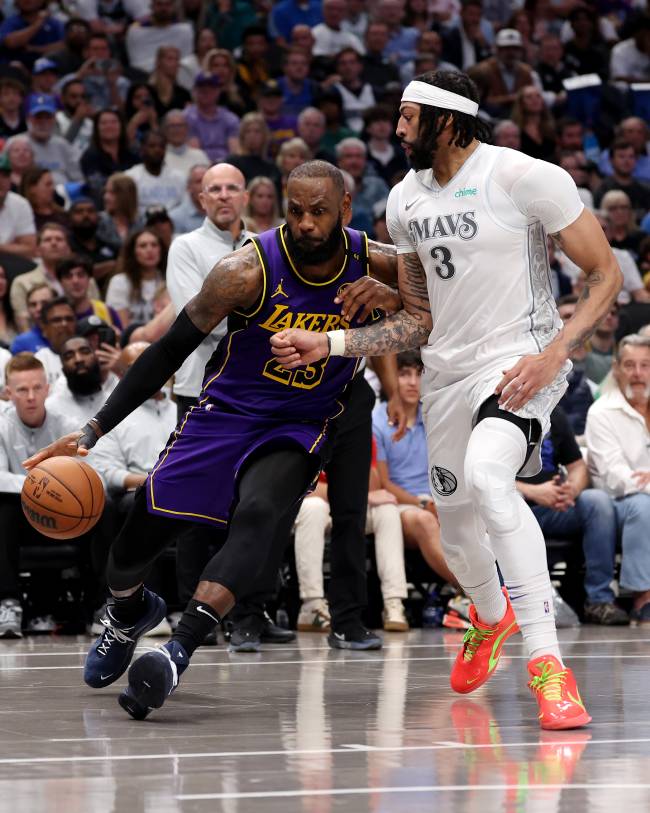 Los Angeles Lakers v Dallas Mavericks DALLAS, TEXAS - APRIL 09: LeBron James #23 of the Los Angeles Lakers dribbles the ball as Anthony Davis #3 of the Dallas Mavericks defends during the fourth quarter at American Airlines Center on April 09, 2025 in Dallas, Texas. NOTE TO USER: User expressly acknowledges and agrees that, by downloading and or using this photograph, user is consenting to the terms and conditions of the Getty Images License Agreement.